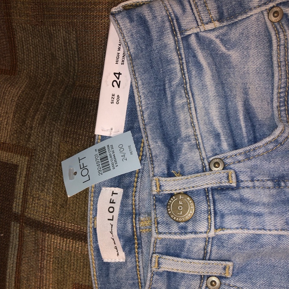 Loft high waisted skinny jeans with distressed bottom
